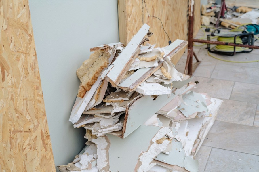 Pile of broken drywall and renovation debris